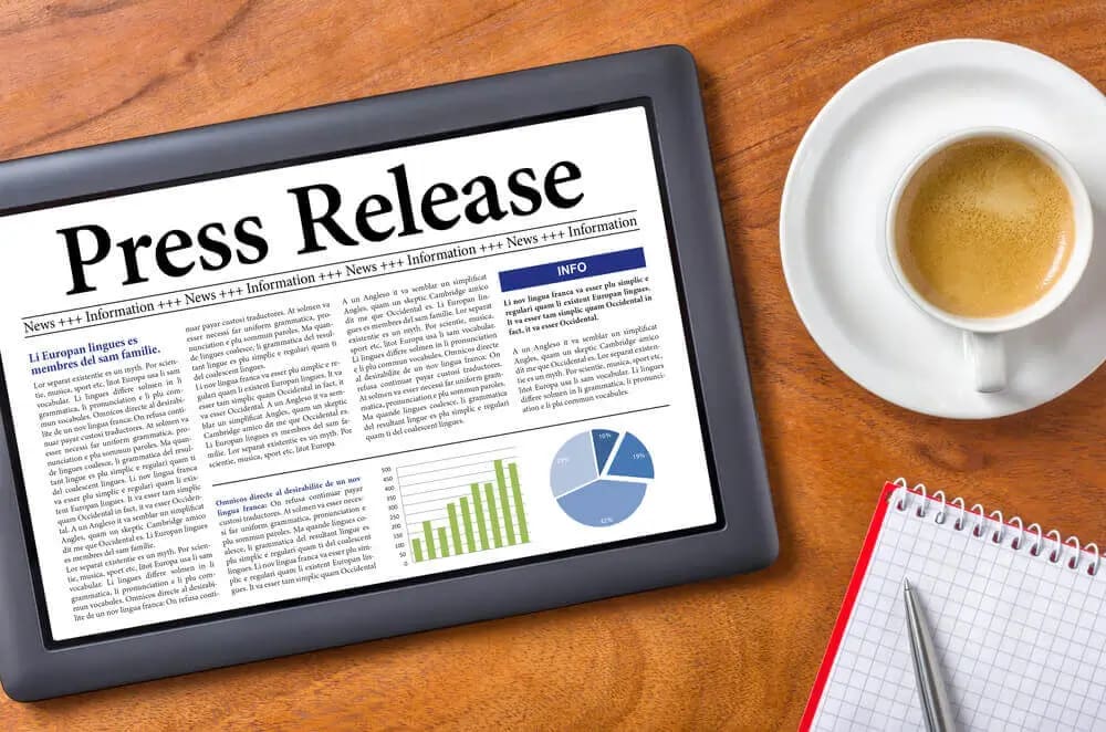 Press release, coffee, and graphic representation.